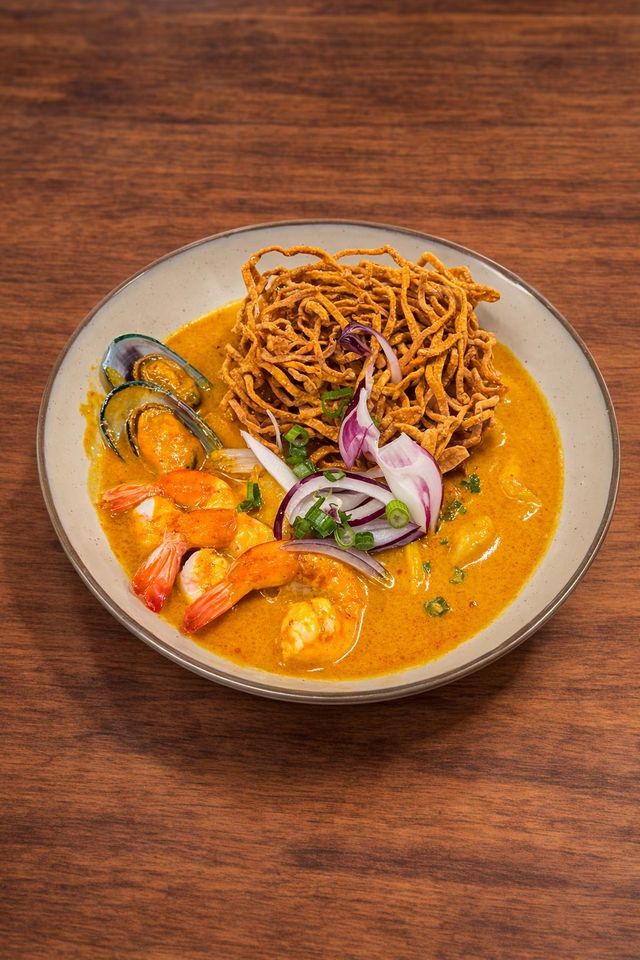 Noodle Monster Khao Soi curry noodle soup with shrimp, herbs, and crispy noodles